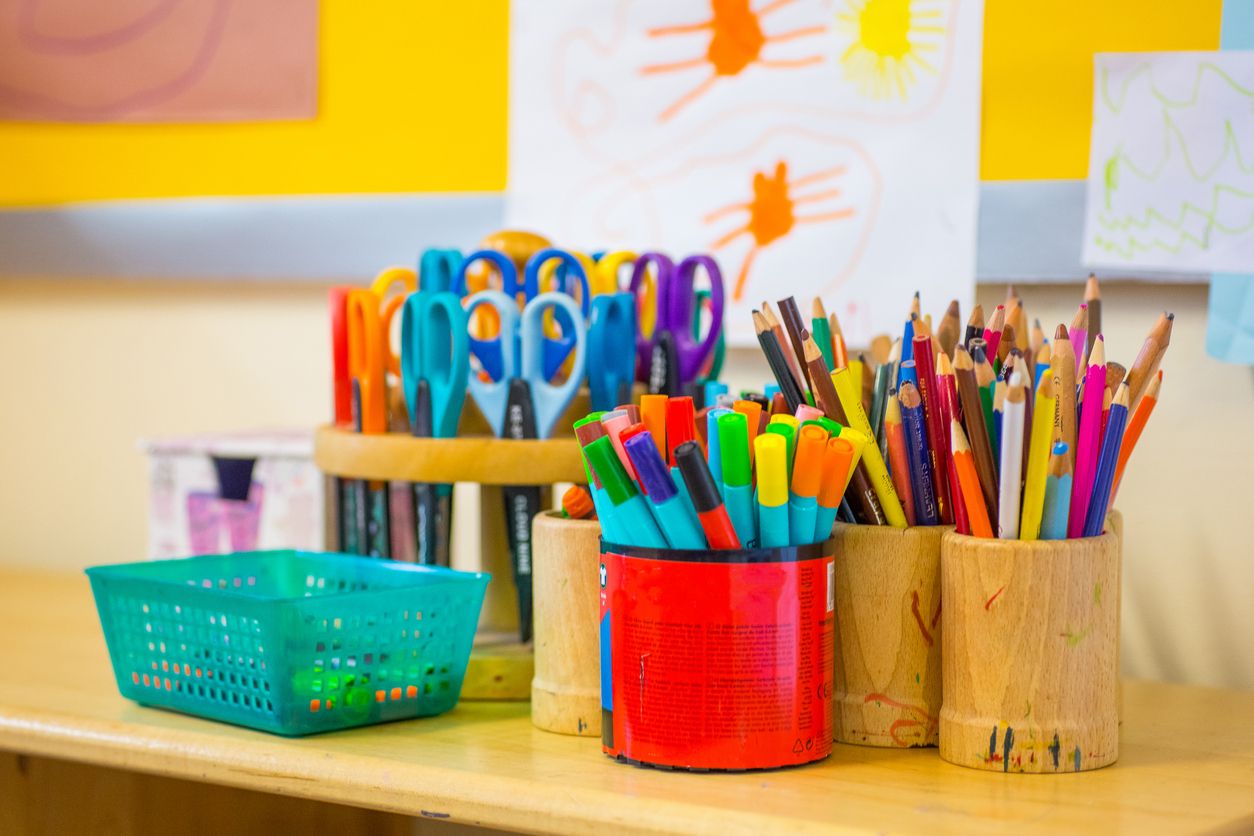 pens, scissors, pencils on a table