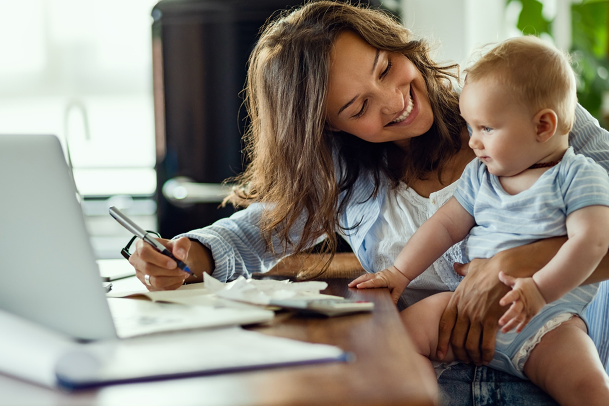 foster mother using computer to look up resources