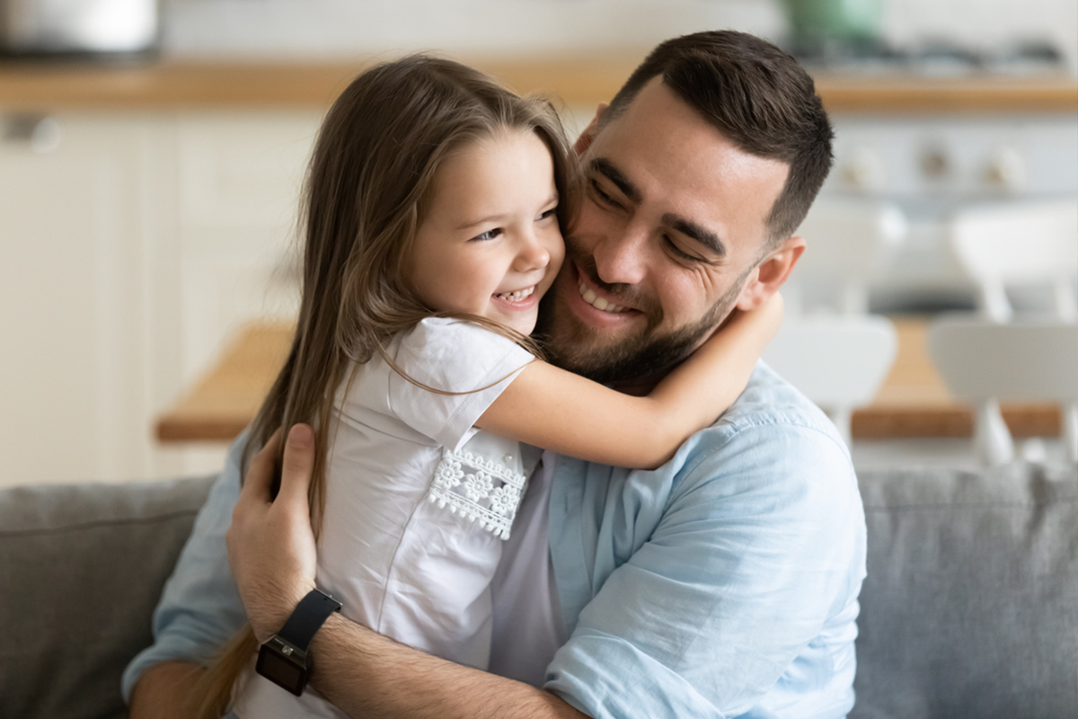 foster dad hugging child